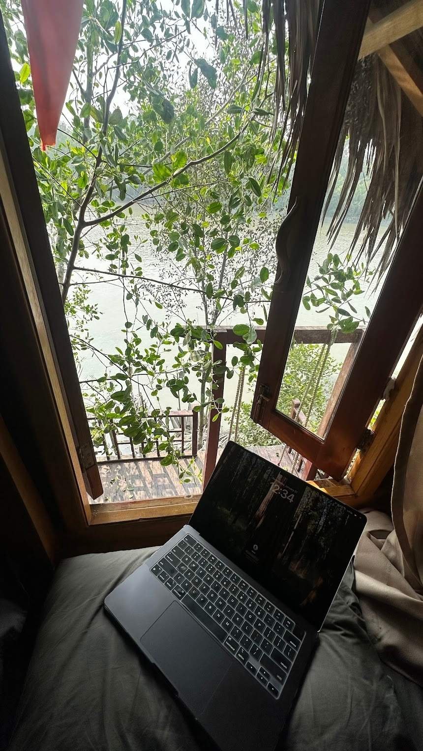 Mo working on Gadgets Feed from a jungle treehouse with a river view